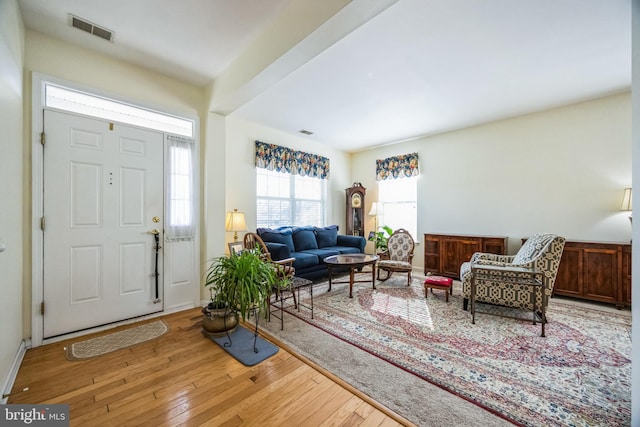 foyer with visible vents and hardwood / wood-style flooring