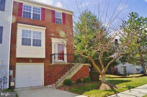 multi unit property featuring a garage