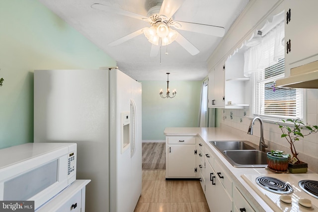 kitchen featuring white cabinetry, sink, white appliances, and decorative backsplash