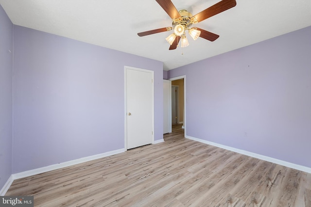 unfurnished bedroom featuring ceiling fan and light hardwood / wood-style floors