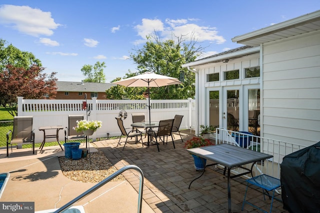 view of patio featuring grilling area and french doors