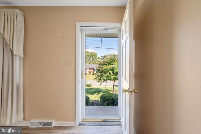 doorway with light hardwood / wood-style flooring