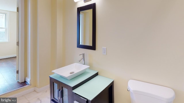 bathroom with toilet and vanity