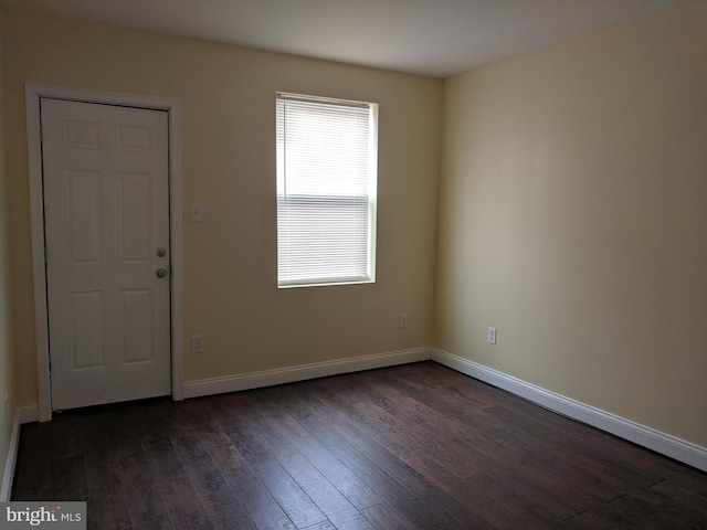 entrance foyer with a healthy amount of sunlight and dark hardwood / wood-style flooring