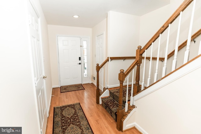 foyer entrance with light hardwood / wood-style flooring