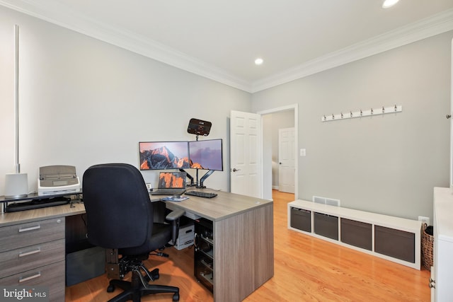 home office featuring light wood finished floors, visible vents, ornamental molding, and recessed lighting