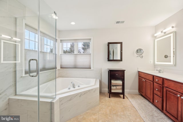 bathroom featuring a garden tub, a shower with shower door, visible vents, vanity, and tile patterned floors