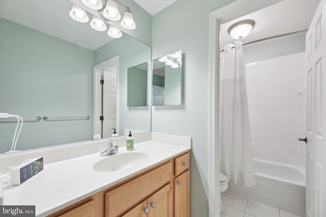 bathroom featuring shower / bath combination with curtain, tile patterned flooring, vanity, and toilet