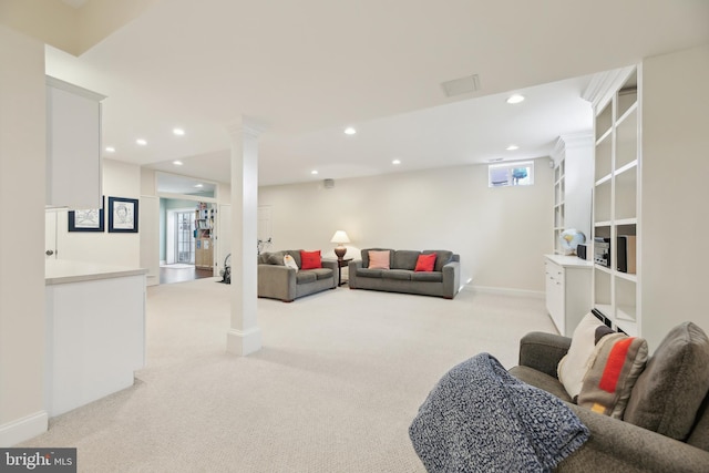 living room with light carpet, ornate columns, baseboards, and recessed lighting