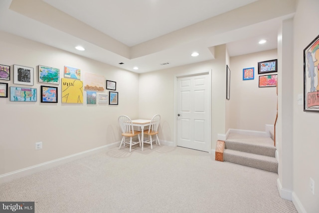 interior space featuring carpet floors, recessed lighting, visible vents, and baseboards