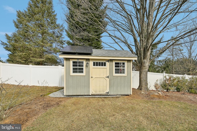 view of shed with a fenced backyard