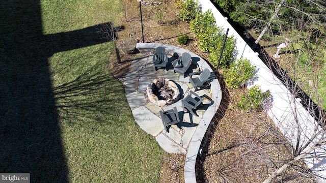 details with an outdoor fire pit and fence