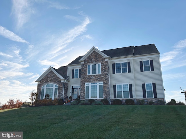 100 Bolero Dr, Downingtown, PA 19335 - view of front of house featuring stone siding and a front yard