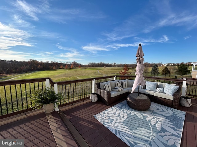 deck featuring a yard and outdoor lounge area