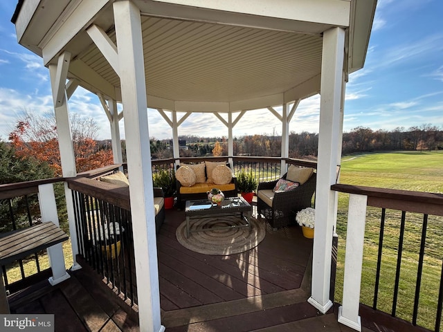 deck with a lawn and outdoor lounge area