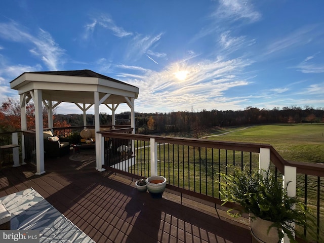 deck with a lawn and a gazebo