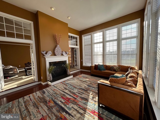 interior space featuring a high end fireplace and hardwood / wood-style flooring