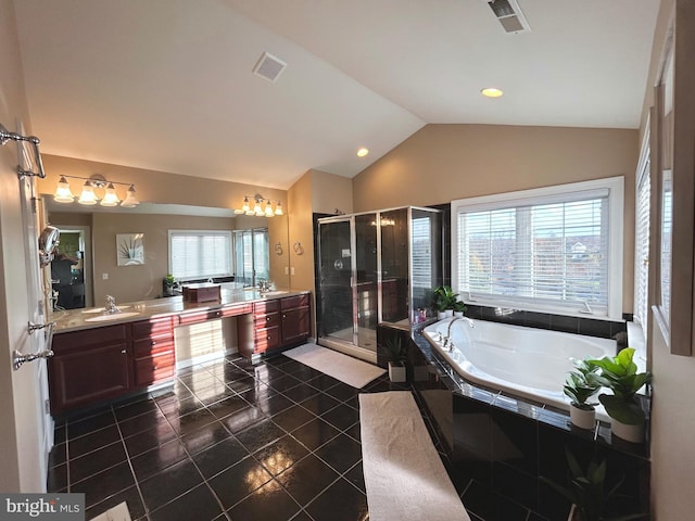 bathroom with lofted ceiling, tile patterned flooring, separate shower and tub, and vanity