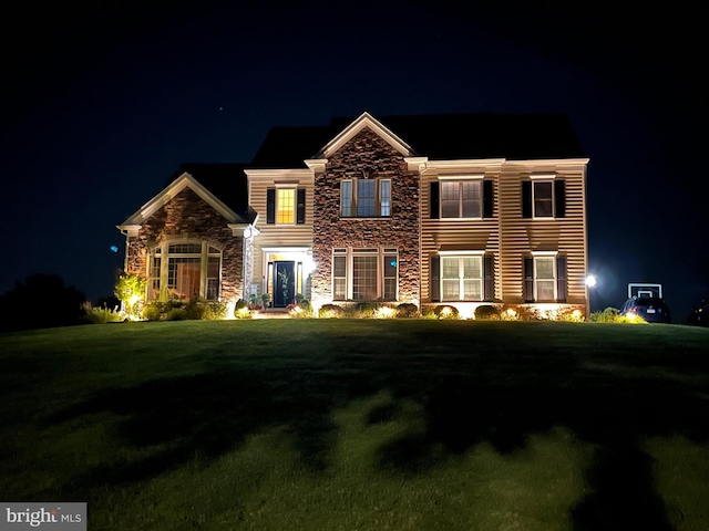 view of front of property with a yard