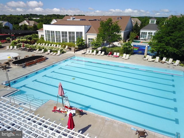 view of swimming pool with a patio