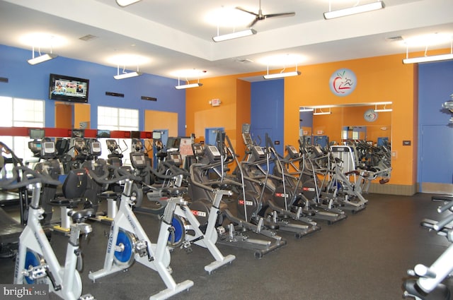 gym with a towering ceiling