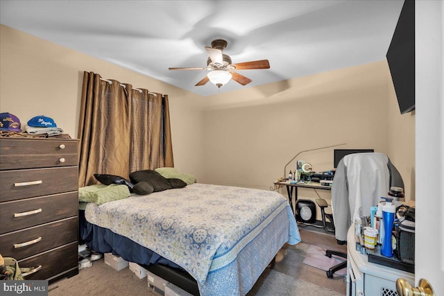 bedroom with ceiling fan and dark carpet