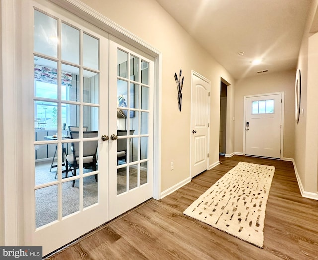 doorway to outside with hardwood / wood-style flooring and french doors