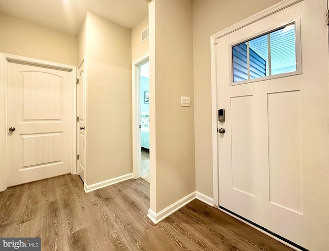 foyer entrance with light hardwood / wood-style flooring