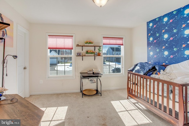 bedroom featuring light carpet