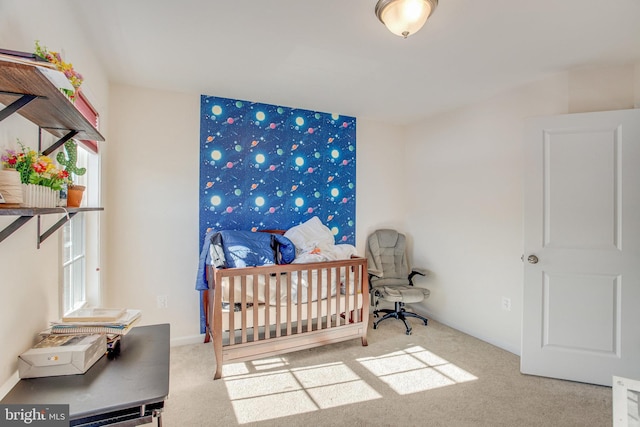 carpeted bedroom featuring a nursery area and multiple windows