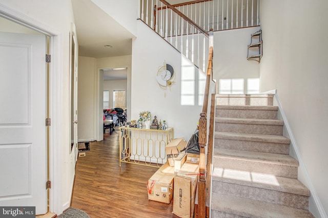 staircase featuring hardwood / wood-style flooring