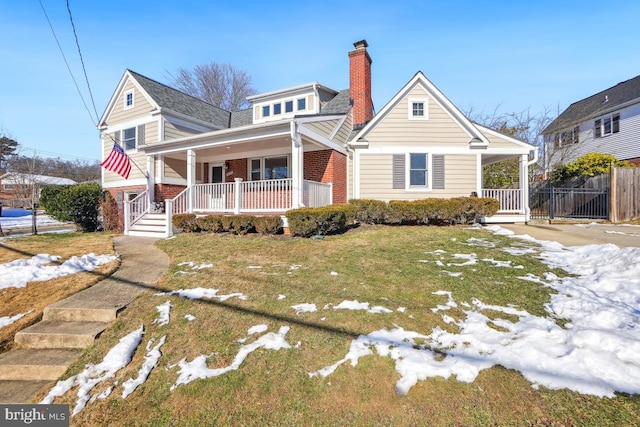 view of front of property with a front lawn and a porch