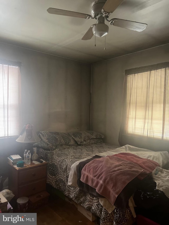 bedroom featuring ceiling fan and hardwood / wood-style flooring