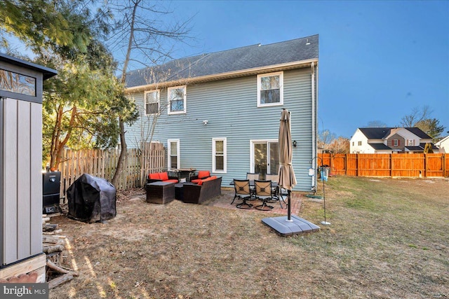 rear view of house with an outdoor hangout area and a lawn