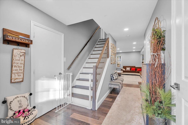 stairs with hardwood / wood-style flooring