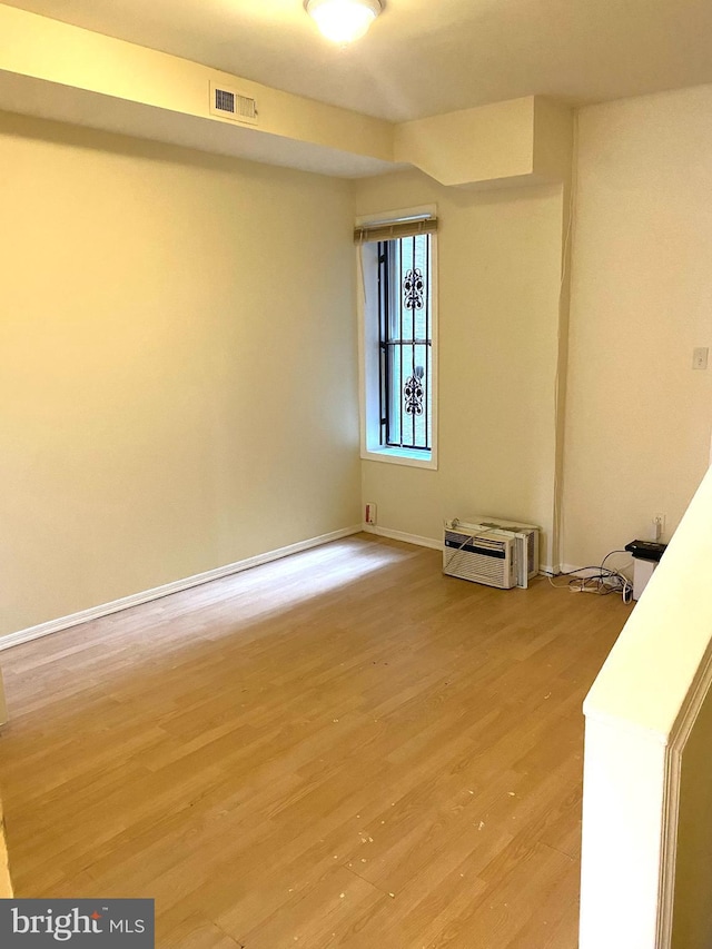 unfurnished room with light hardwood / wood-style floors