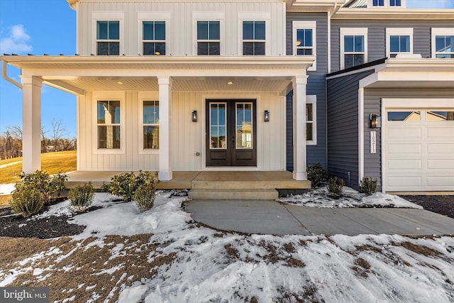 view of front of house with a garage and covered porch