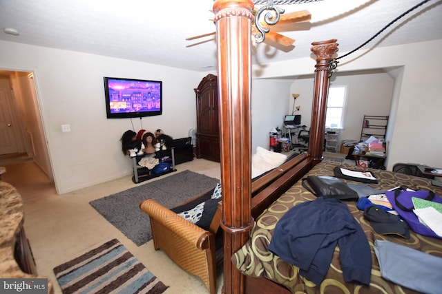 bedroom with ceiling fan and light colored carpet