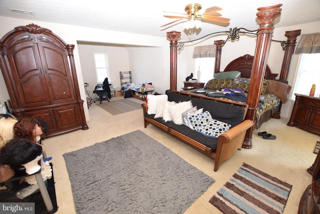 bedroom featuring ceiling fan and light colored carpet