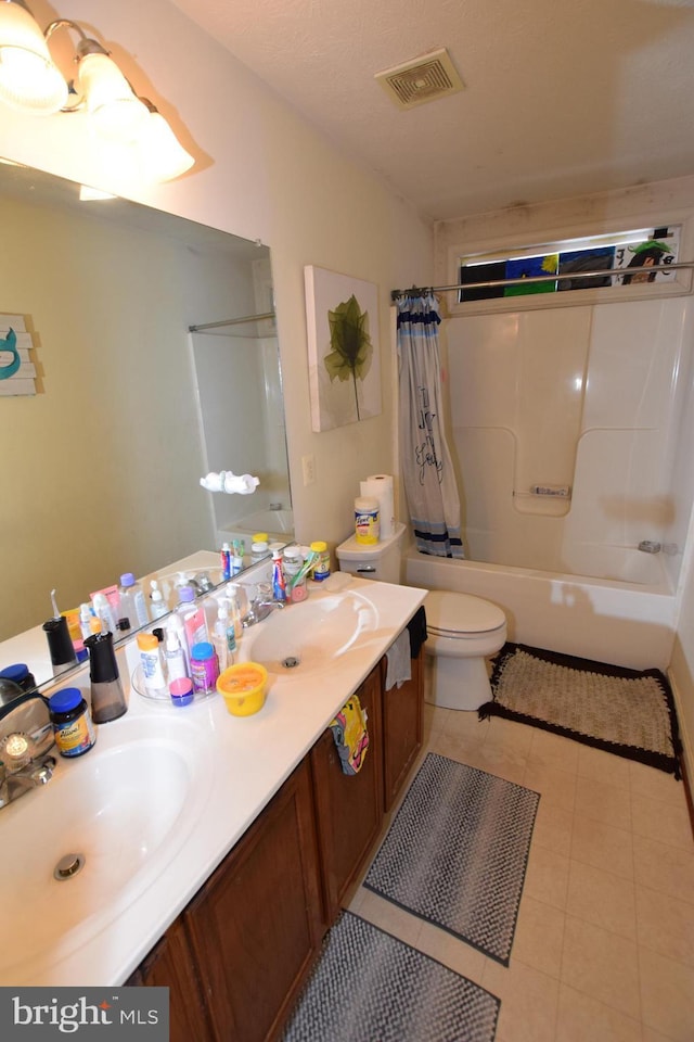 full bathroom featuring toilet, shower / bath combination with curtain, tile patterned floors, and vanity