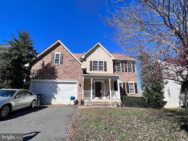 view of front of house featuring a garage and covered porch