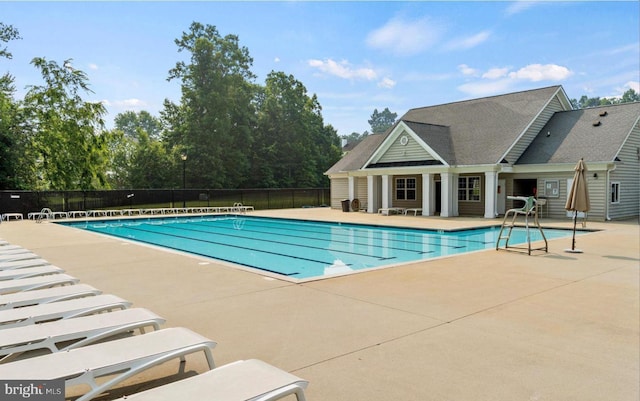 view of swimming pool with a patio