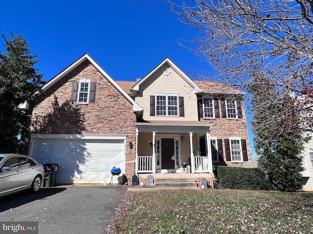 view of front of home featuring a garage and covered porch