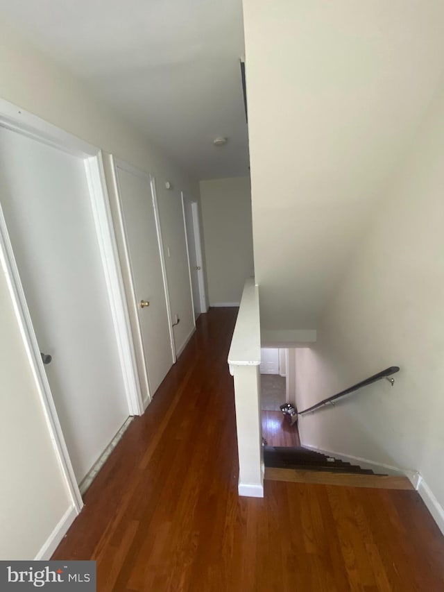 hallway featuring dark hardwood / wood-style floors