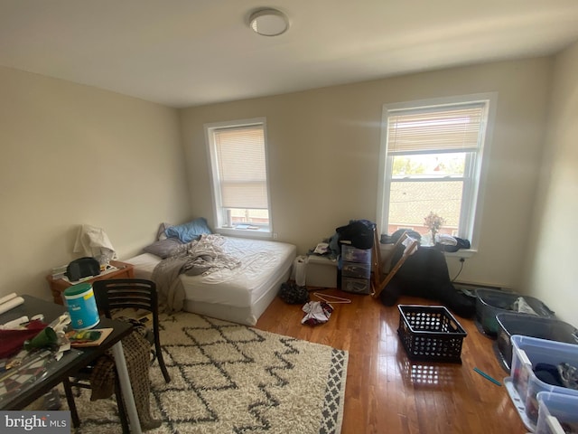 bedroom with hardwood / wood-style floors