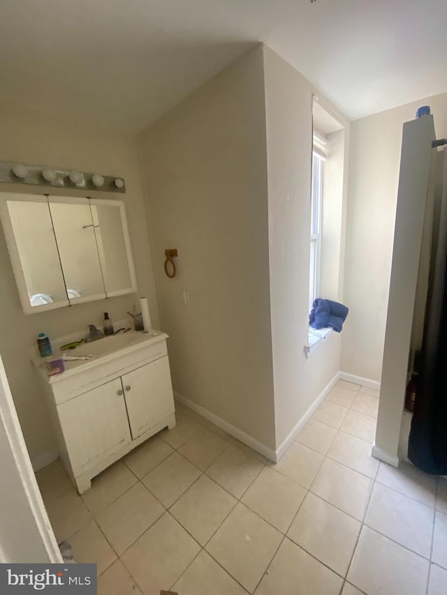 bathroom with vanity and tile patterned flooring