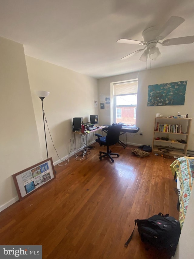 home office featuring ceiling fan and hardwood / wood-style flooring