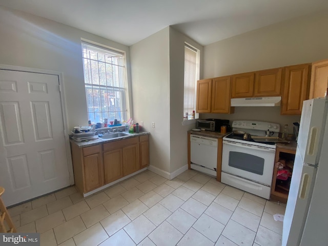 kitchen featuring sink and white appliances