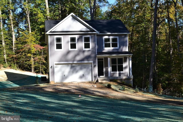 traditional-style home with dirt driveway and an attached garage