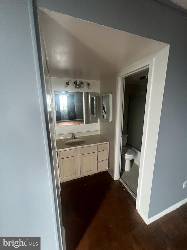 bathroom with vanity and toilet